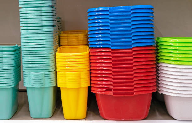 Stacks of colorful plastic buckets and basins.