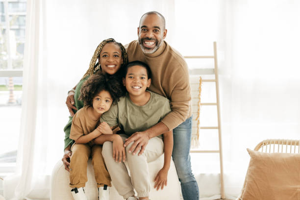 istock Two parents and two kids looking at camera 1371595536