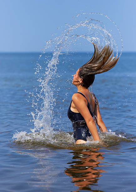 istock Girl splashing water 137159583