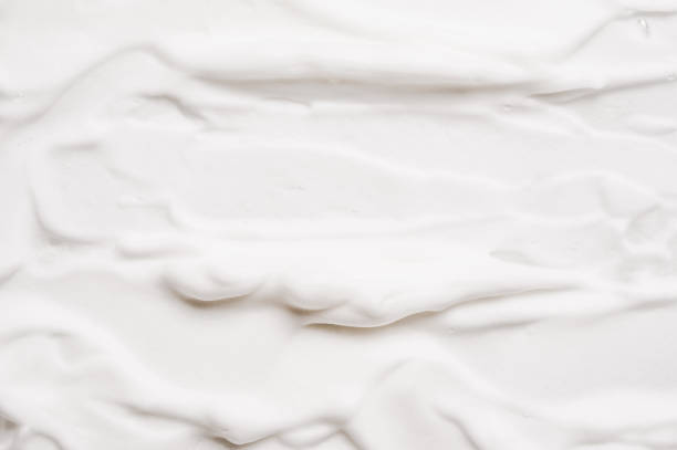 istock Mousse soft white foam soap of shaving cream texture background. 1371596623