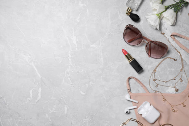 istock Flat lay composition with women's accessories on light grey marble background. Space for text 1371609242