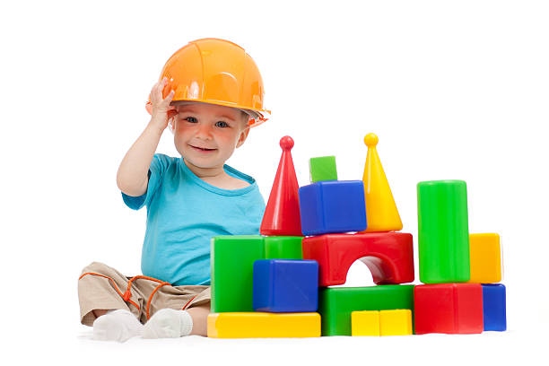 istock little boy with hard hat playing building blocks 137161034