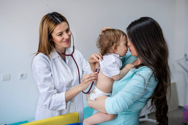 istock Doctor examining baby boy with stethoscope 1371610484