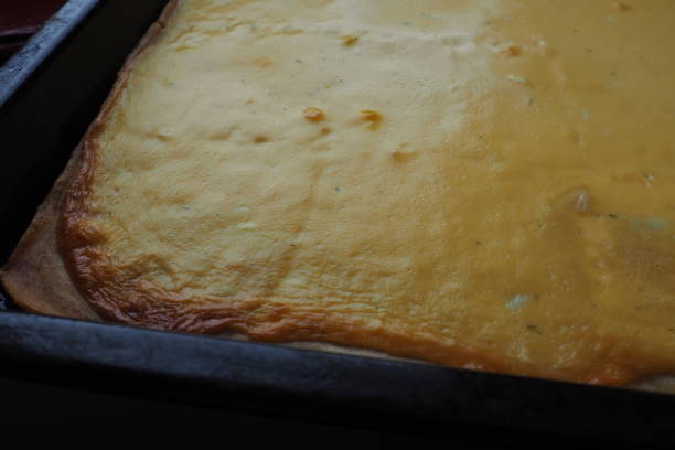 istock Razlevusha or razlevak, delicious Balkan pie or flatbread baked in the oven on a baking sheet of eggs, flour, cheese, sour cream or yogurt. Bosnian - Herceg - Serbian - Macedonian - Croatian recipe 1371620280