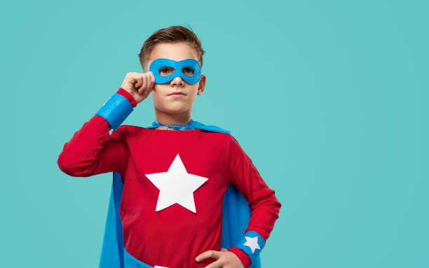 istock Brave superhero boy in mask in studio 1371620625