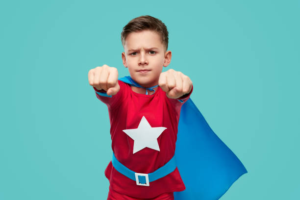 istock Serious superhero boy flying in studio 1371620628