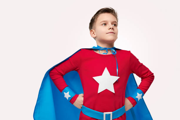 istock Brave superhero kid in costume in studio 1371620645