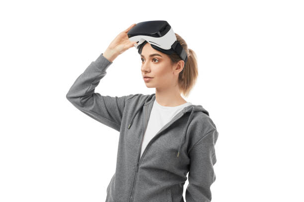 istock Woman with VR headset on white background 1371620665