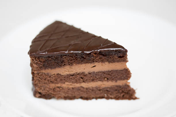 istock Piece of chocolate cake is on white background 1371622432