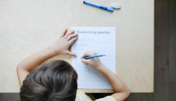 istock A schoolboy doing math lesson sitting at desk in the children room 1371640089