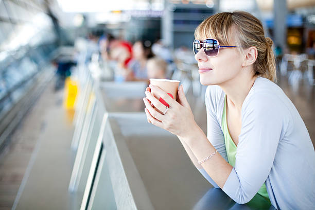 Young Woman In Airport Café stock photo