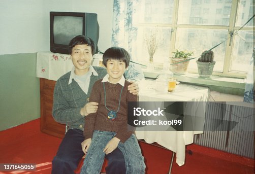 istock 1980s Chinese Little Boy and Father Old Photo of Real Life 1371645055