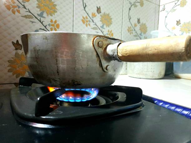 istock a stove that is burning on it has a pot 1371646333