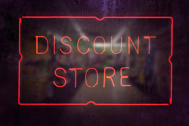 istock Discount Store Neon Sign in Rainy Window 1371652680