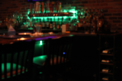 Blur Background Bar and Restaurant Interior with Green Lights
