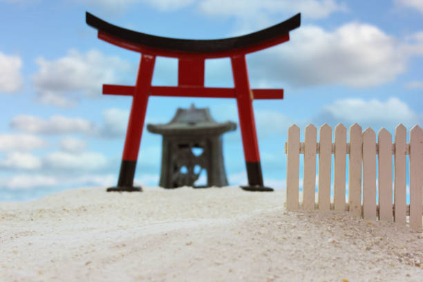 Torii Gate and Temple on Beach With Blue Sky Torii Gate and Temple on Beach Shallow DOF torri gate stock pictures, royalty-free photos & images