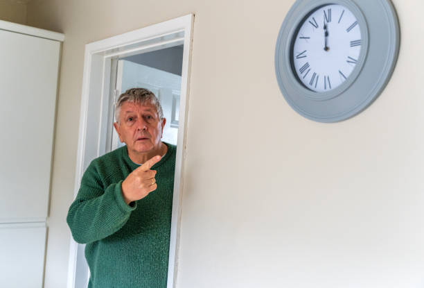istock Senior Caucasian man peering around doorway 1371662116