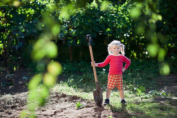 child ready to dig stock photo