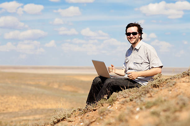 man with laptop stock photo