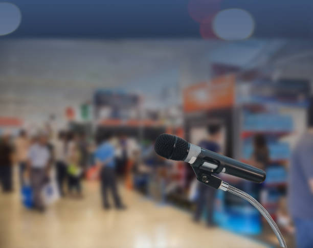 istock Microphone is blurry and soft on stage, meeting or event with blurred background. 1371669501