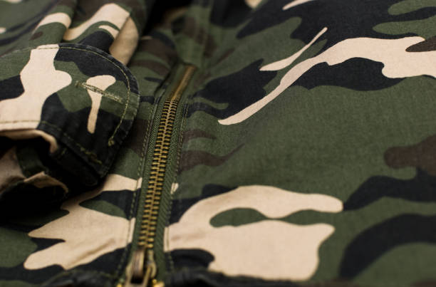 istock Military camouflage uniform, close up 1371670352