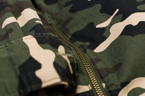 istock Military camouflage uniform with zipper, close up 1371670354