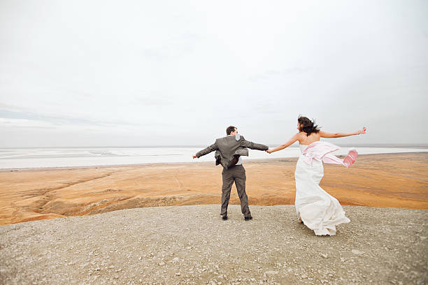 istock couple ready to jump on the mountain 137167048
