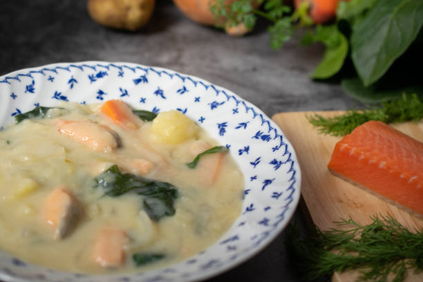 istock Salmon and spinach cream stew and its ingredients on the table 1371670648