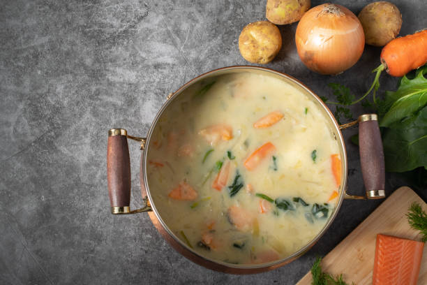 Salmon and spinach cream stew and its ingredients on the table