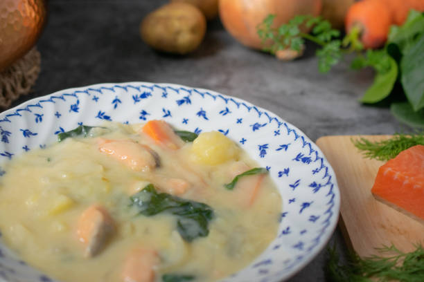 istock Salmon and spinach cream stew and its ingredients on the table 1371670741