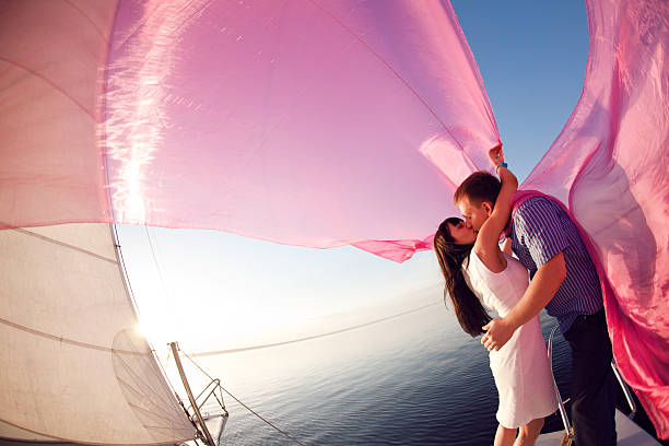 kiss under the sail stock photo