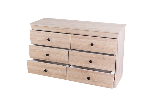 New light opened chest of drawers isolated on white background