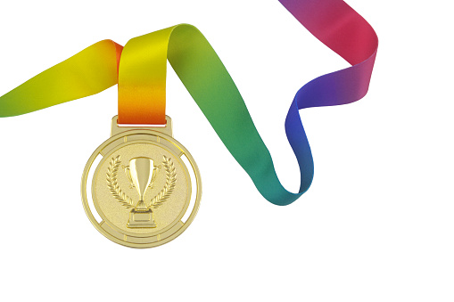 Gold medal with trophy cup and colorful ribbon isolated on white background, copy space for text.
