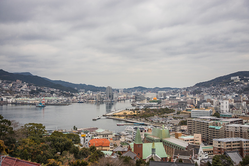 View of Nagasaki city bay from the hill in a cloudy day. Nagasaki prefecture. Kyushu
