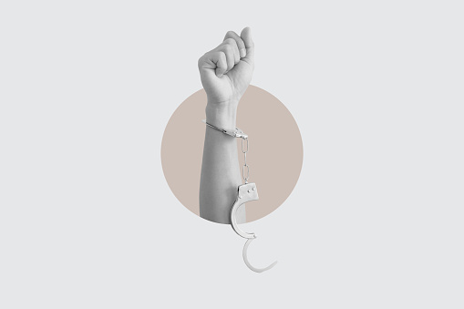 Digital collage modern art. Freedom hand raised with unchain handcuffs