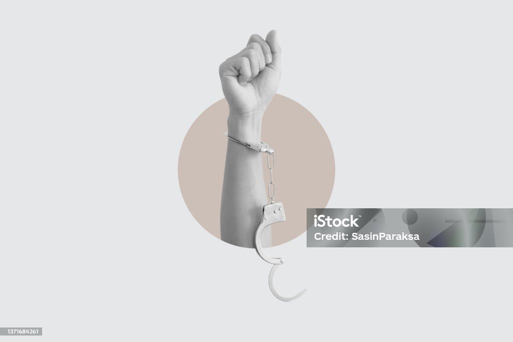 Digital collage modern art. Freedom hand raised with unchain handcuffs Digital collage modern art. Freedom hand raised with unchain handcuff Handcuffs Stock Photo