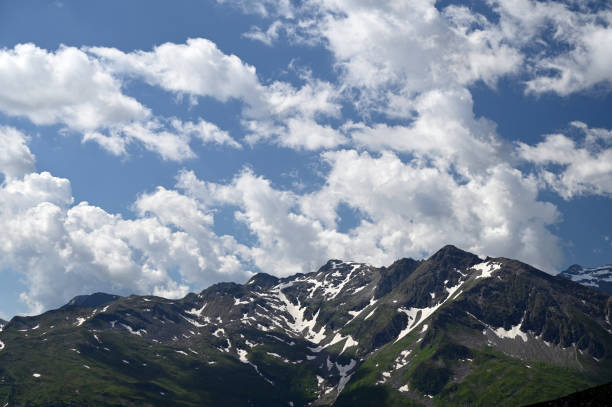 istock Stubnerkogel mountains and blue sky with clouds in Bad Gastein 1371684849