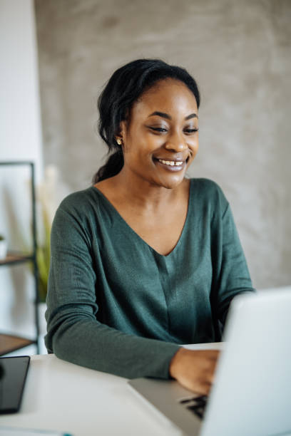 istock African woman working on laptop in office 1371685028