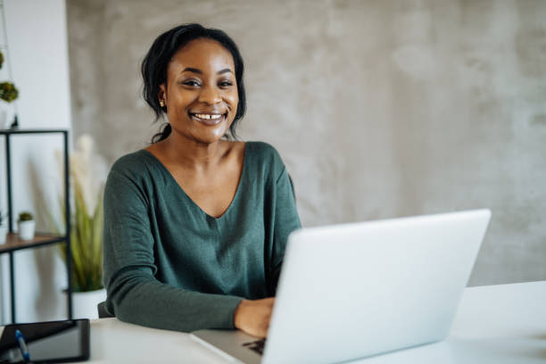 istock African woman working on laptop in office 1371685030
