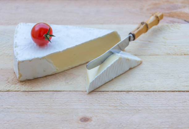istock Cheese and cherry tomatoes on wooden background. 1371692497