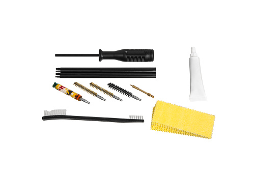 Weapon cleaning kit. Brushes, ramrod, patches and cleaning fluid. Isolate on a white background.