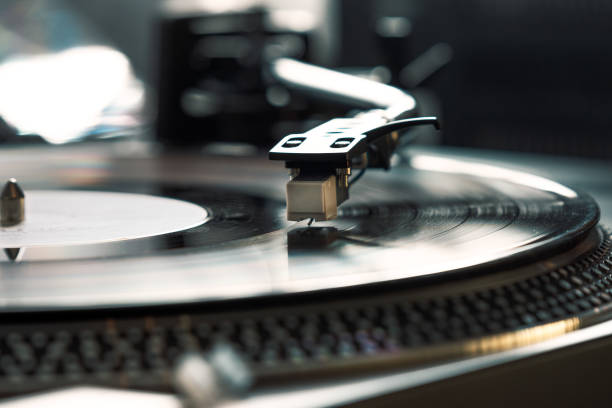 istock Close-up, vintage vinyl record player, While playing the record, Black vinyl platter 1371696989