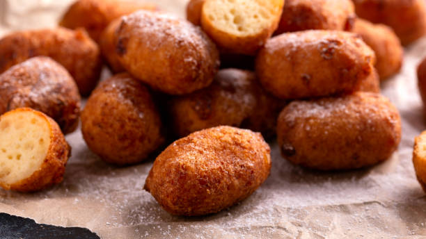 istock Homemade cottage cheese donuts with powdered sugar 1371697056