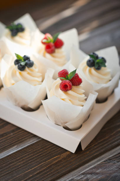 istock Six cream cakes decorated with berries on a stand 3624. 1371697135