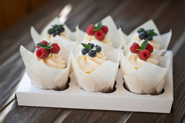 istock Six cream cakes decorated with berries on a stand 3623. 1371697158