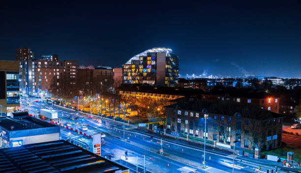 Hundreds of various types of buildings make up the city of Manchester, UK, here seen a landscape view of Manchester's skyline at night.