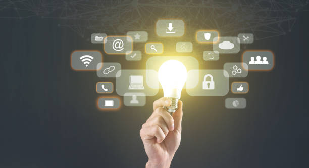 istock Male hand holding light bulb, business and network symbols. Network connection 1371698795