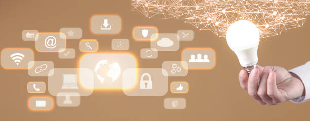 istock Male hand holding light bulb, business and network symbols. Network connection 1371698801