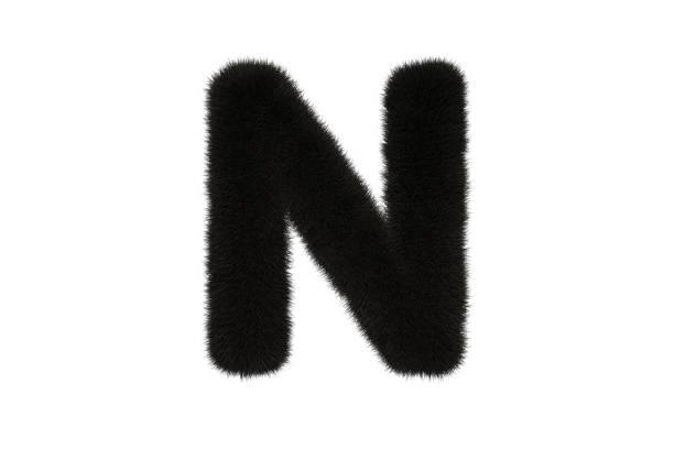 istock Letter N with black fluffy hairy fur uppercase white background 1371700133