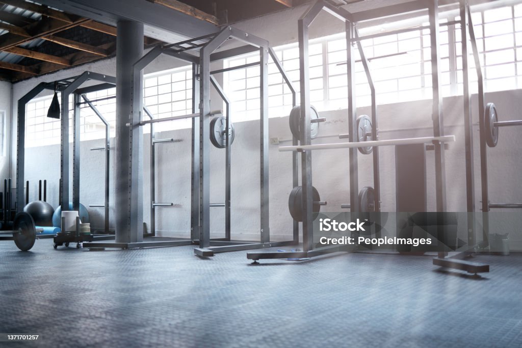 Shot of weight training equipment in a gym Your workout is waiting for you Gym Stock Photo